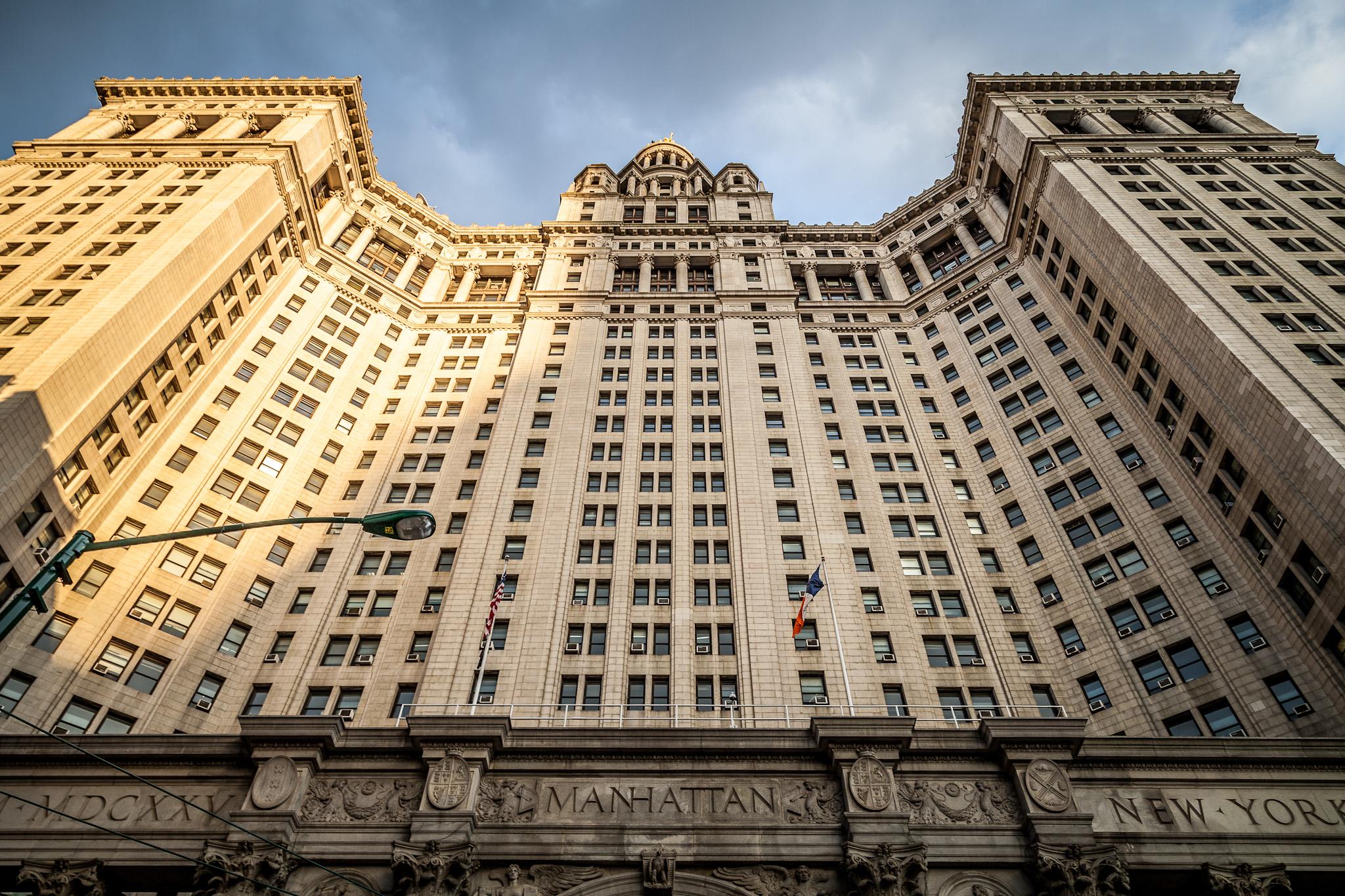 A low-angle shot of the Manhattan Municipal
Building.